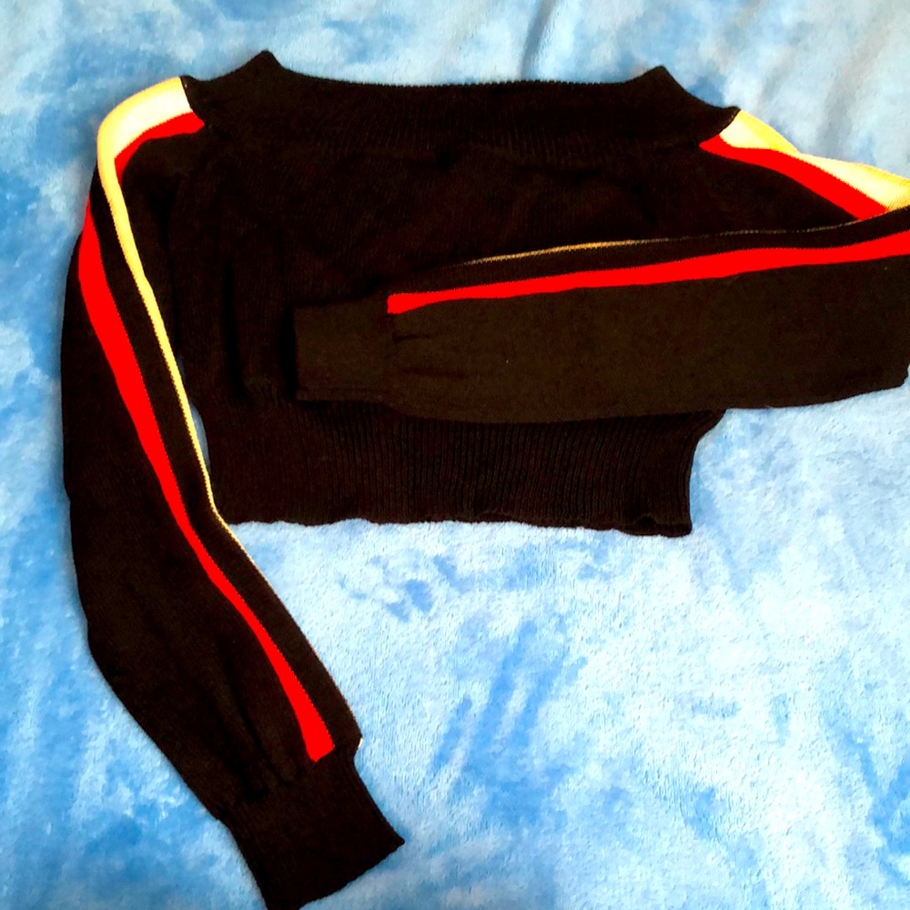 Black cropped off shoulder sweater with tan white red stripe down sleeve